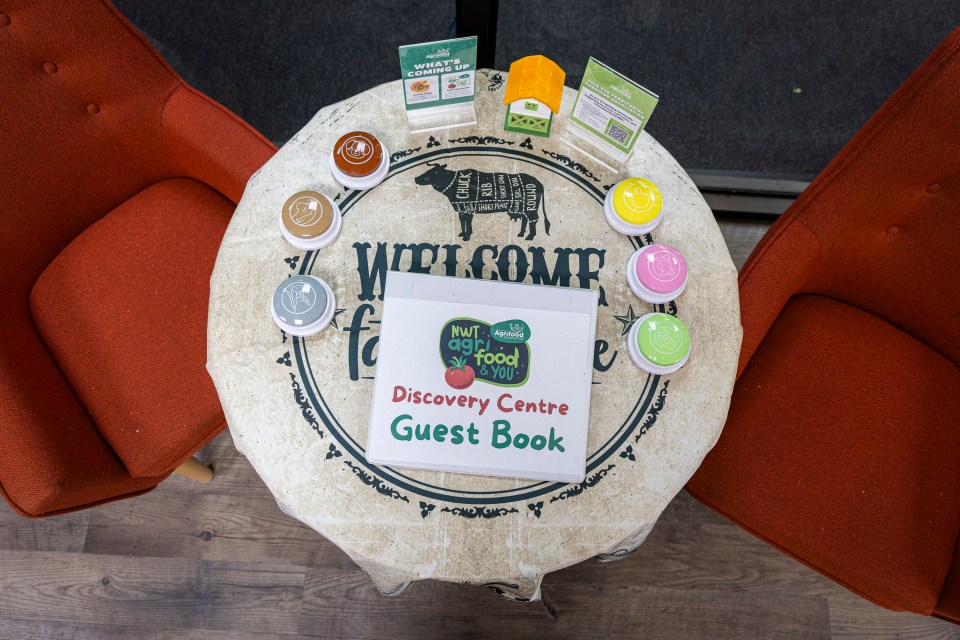 The discovery centre's welcome table with guest book (and animal sounds). Ollie Williams/Cabin Radio