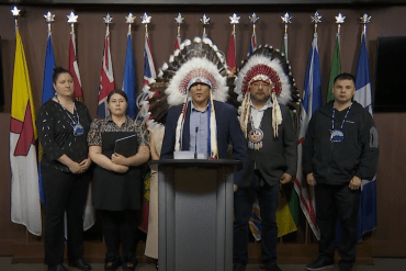 Mikisew Cree First Nation Chief Billy-Joe Tuccaro, centre, speaks at a press conference in Ottawa livestreamed on CPAC.
