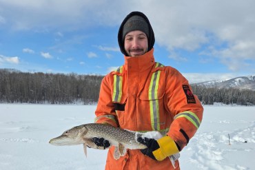 Jared Jones from Kamloops, BC caught the first fish in the Fort Liard Ice Fishing Derby. Photo: Sarah Dickie