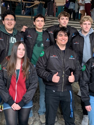 Top row left to right: Nicholas Graham, Marcus Vandermeer, Joseph Depew, Nolan Dusome. Bottom row left to right: Cindy Kimove, Corbi Roy, Andrew dun Figueroa, Holly Murray. Alice Twa/Cabin Radio