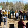Staff look on as environment minister Jay Macdonald speaks at the territorial fire centre's groundbreaking ceremony in Fort Smith on May 1, 2026. Photo: GNWT