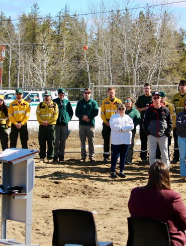Staff look on as environment minister Jay Macdonald speaks at the territorial fire centre's groundbreaking ceremony in Fort Smith on May 1, 2026. Photo: GNWT