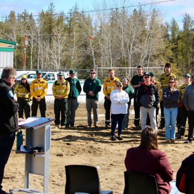 Staff look on as environment minister Jay Macdonald speaks at the territorial fire centre's groundbreaking ceremony in Fort Smith on May 1, 2026. Photo: GNWT