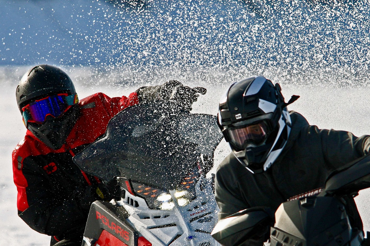 Snowmobile racers at the Mackenzie River Jamboree held in Tsiigehtchic in late April 2026. Photo: Lawrence Norbert