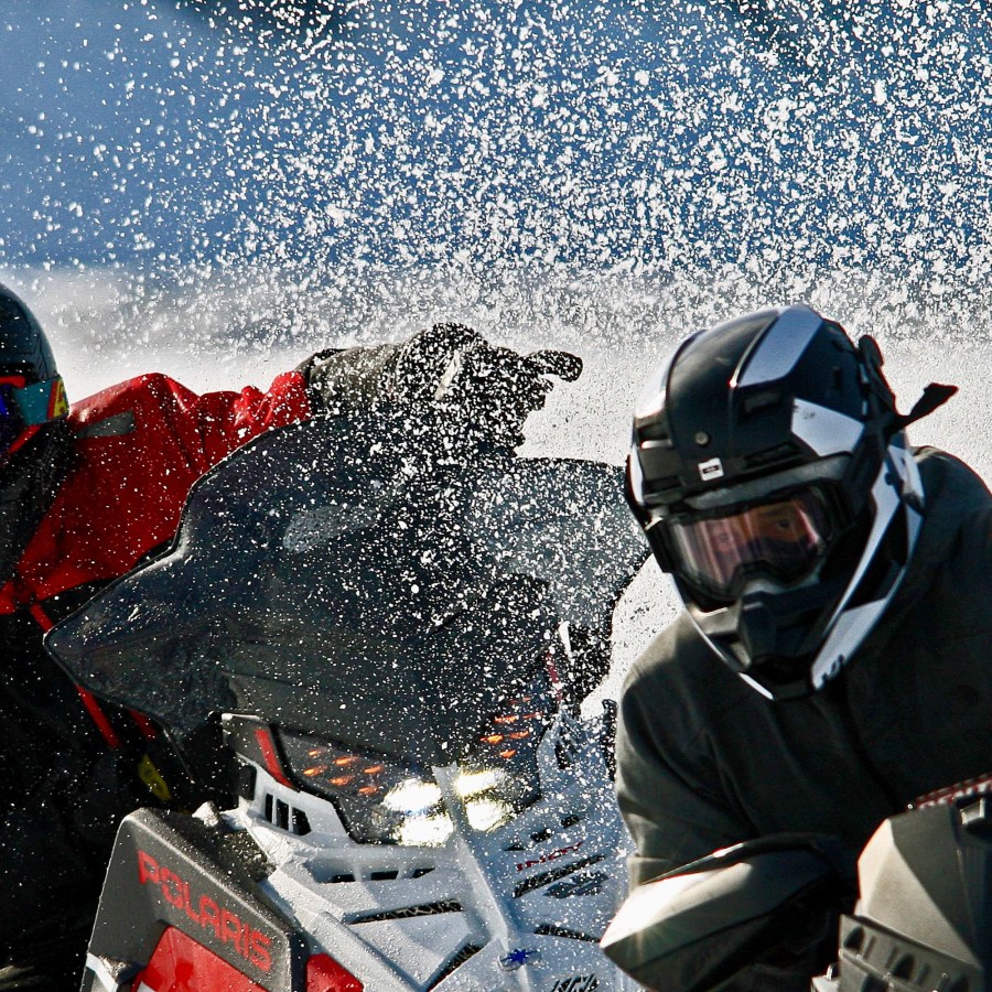 Snowmobile racers at the Mackenzie River Jamboree held in Tsiigehtchic in late April 2026. Photo: Lawrence Norbert