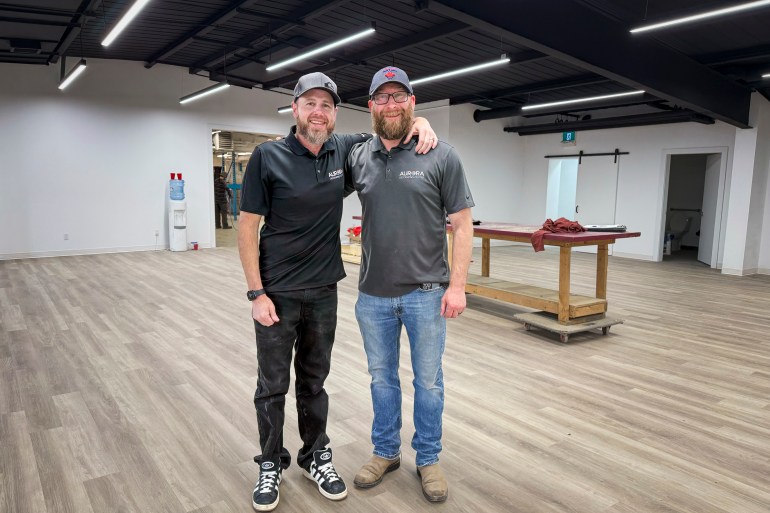 Aurora Decorating Centre's Ash Munro, left, and Stephen Robertson inside the new space. Ollie WIlliams/Cabin Radio