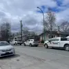 Three police cars outside a home near the intersection of Yellowknife's 50 Avenue and 57 Street. Claire McFarlane/Cabin Radio