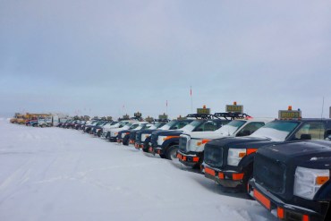 Vehicles used at the now-paused Point Lake development are arranged for storage at the Ekati mine site. Photo: GNWT