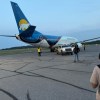 Evacuees head to a Canadian North flight late on June 28, 2026. Photo: Submitted