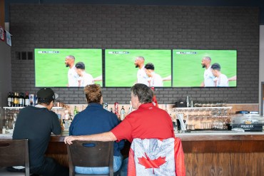 Yellowknifers watch the World Cup at Boston Pizza. Kai Wilson/Cabin Radio
