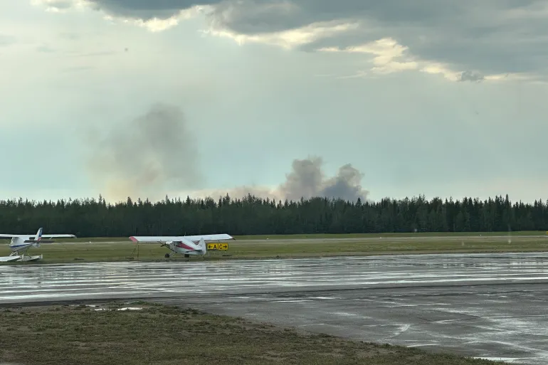 David Myre, who took this photo, said a storm moved through the Fort Simpson region on Friday afternoon and lightning triggered fire FS016, pictured from the airport.