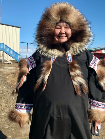 Erin Felix shows off her traditional outfit outside Kitti Hall on June 5, 2026. Cody Punter/Cabin Radio