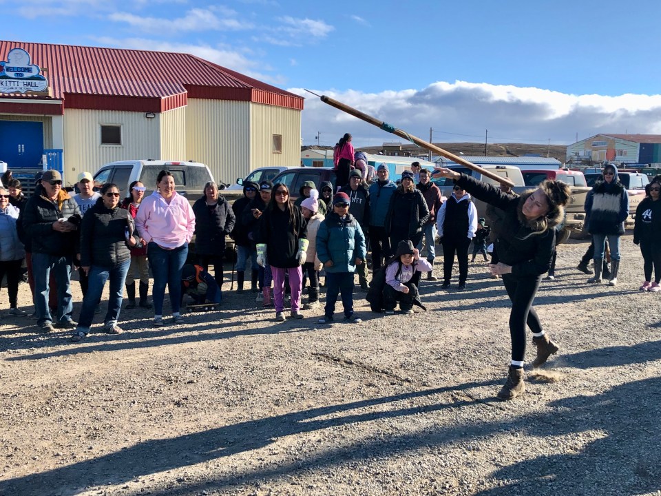 Brenda Wolki takes part in the harpoon toss as part of Inuvialuit Day celebrations in Tuktoyaktuk on June 5, 2026. Cody Punter/Cabin Radio