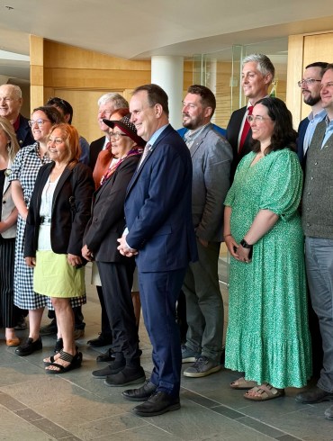 Federal, territorial and Indigenous leaders gathered on June 24, 2026 to announce the probable fast-tracking of the Mackenzie Valley Highway. Ollie Williams/Cabin Radio