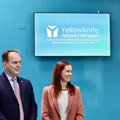 Federal transport minister Steven MacKinnon, left, and NWT deputy premier Caroline Wawzonek at Yellowknife Airport. Emily Blake/Cabin Radio