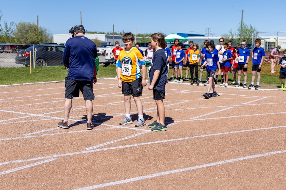 Athletes are lined up for the boys' U13 1,500m race at Track and Field 2026. Ollie Williams/Cabin Radio