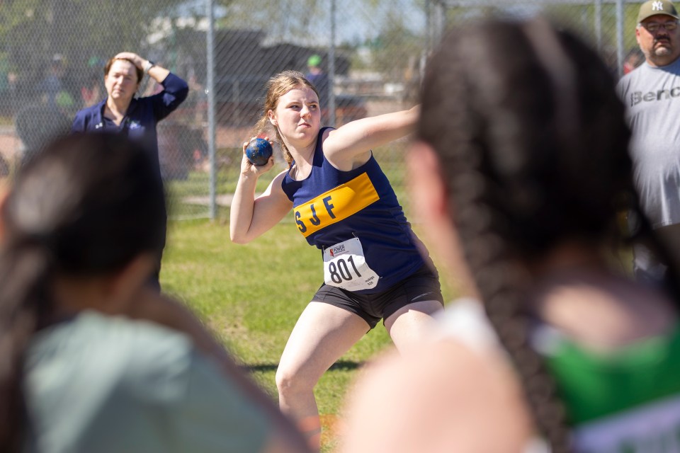 Anna Aikman throwing for Sir John Franklin High School. Ollie Williams/Cabin Radio