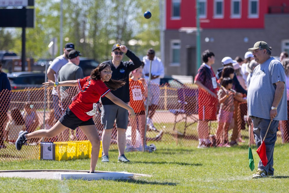 Mildred Hall's Ori Black takes part in shot put. Ollie Williams/Cabin Radio