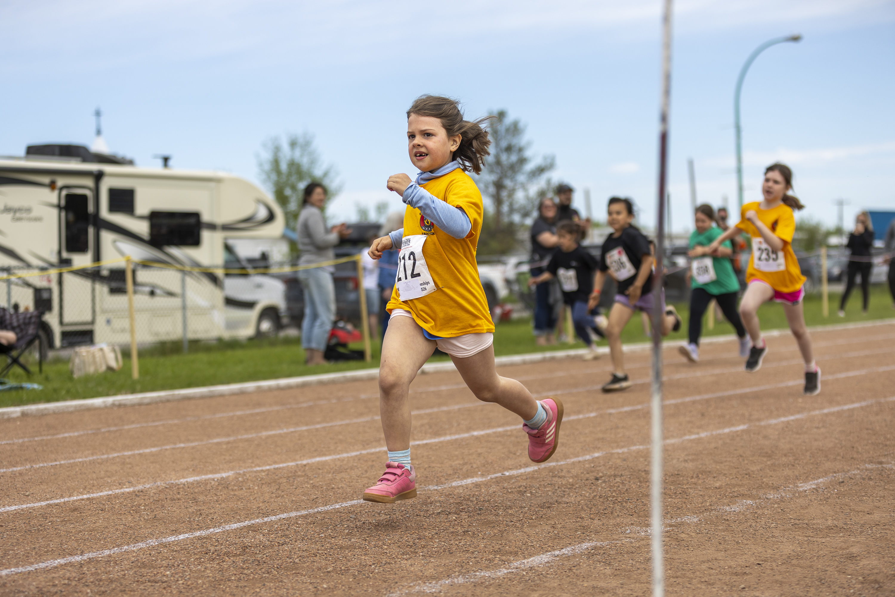 École Boréale's Billie Cook powers toward the finish line. Ollie Williams/Cabin Radio