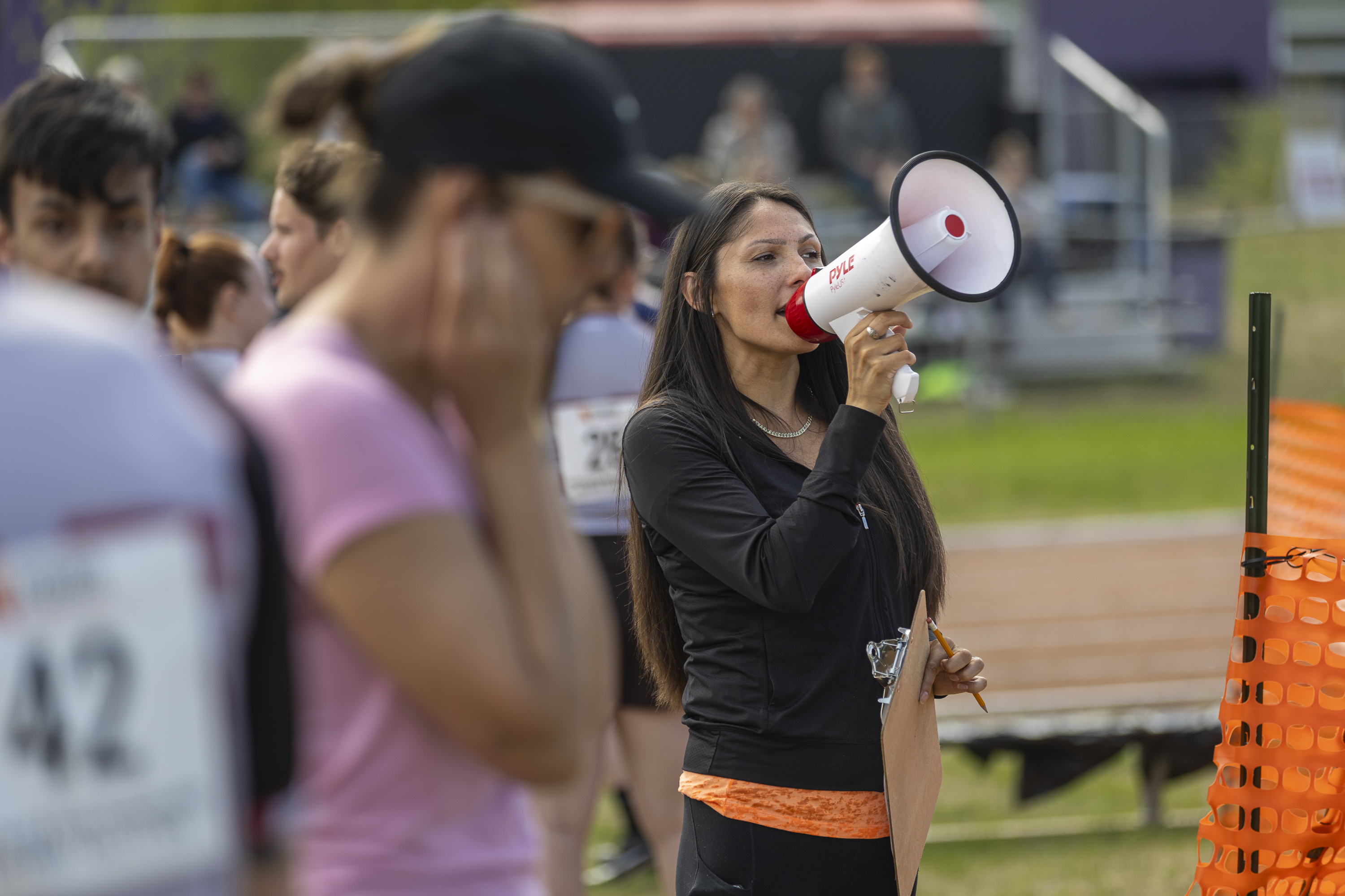 A megaphone is a requirement to herd athletes pre-race. Ollie Williams/Cabin Radio