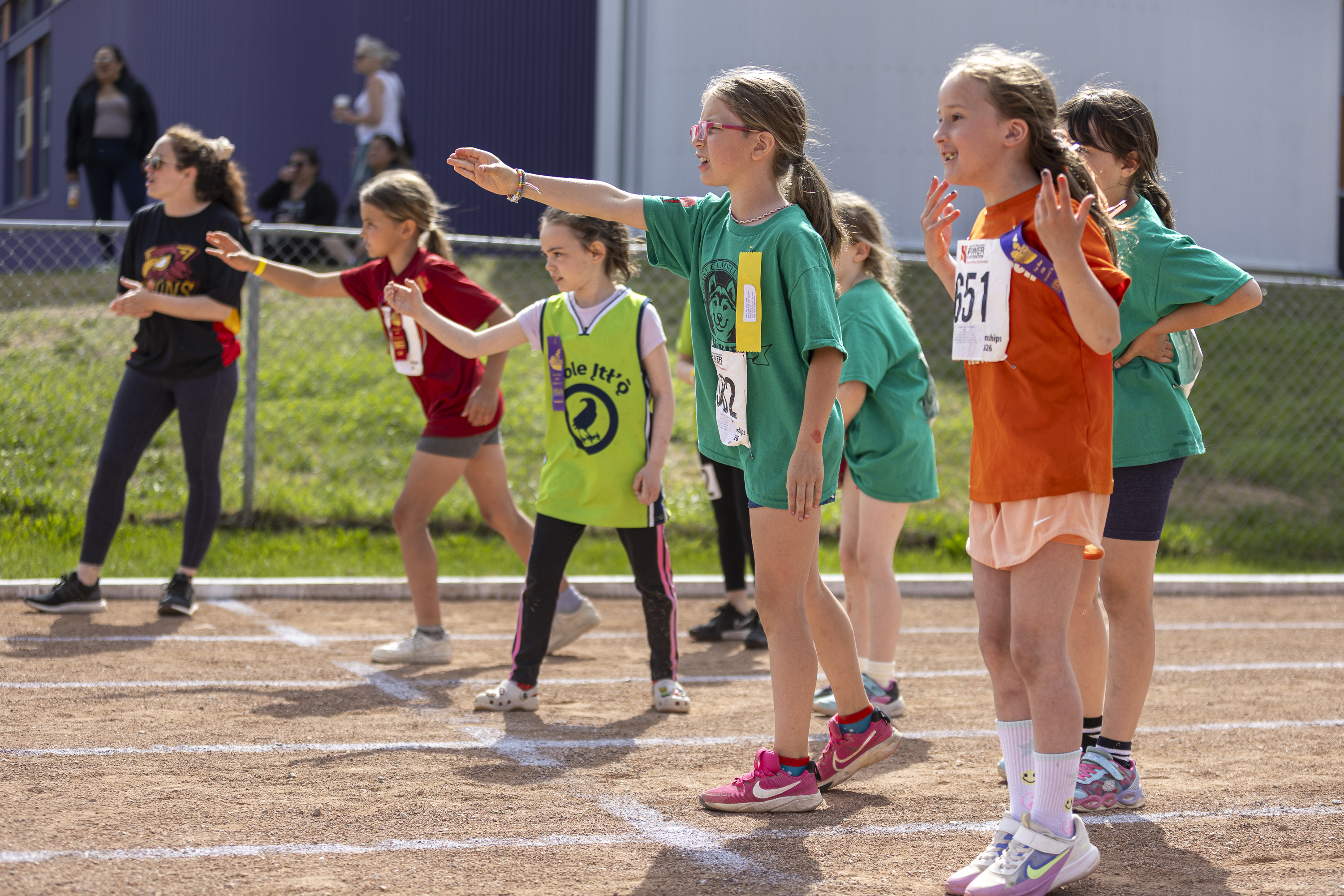 Shuttle relay participants anxiously await the baton from their team-mates. Ollie Williams/Cabin Radio