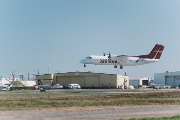 An Air Tindi plane lands at the Yellowknife Airport in May 2026. Sarah Pruys/Cabin Radio