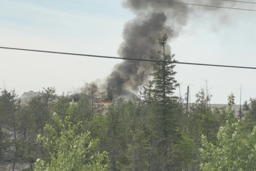 The Yellowknife dump's second fire of the day spews smoke into the air on June 24, 2026. Photo: Submitted