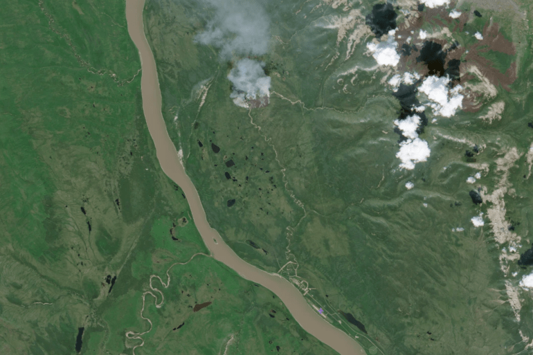 A Sentinel-2 satellite image shows wildfire FS-015 north of Wrigley on June 27, 2026.