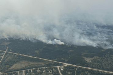 Fire FS016's eastern edge near Fort Simpson's Wildrose subdivision at 4:45pm on June 30, 2026. Photo: NWT Fire