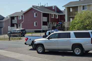 RCMP outside a Williams Avenue building on June 29, 2026. Jesse Wheeler/Cabin Radio
