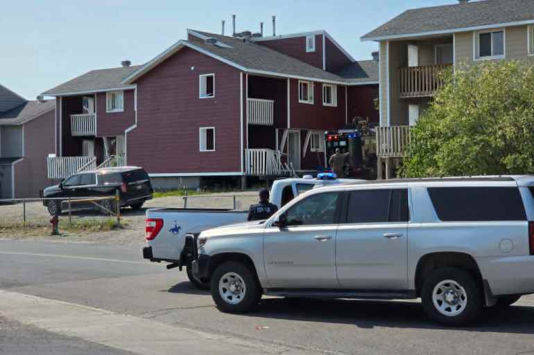 RCMP outside a Williams Avenue building on June 29, 2026. Jesse Wheeler/Cabin Radio