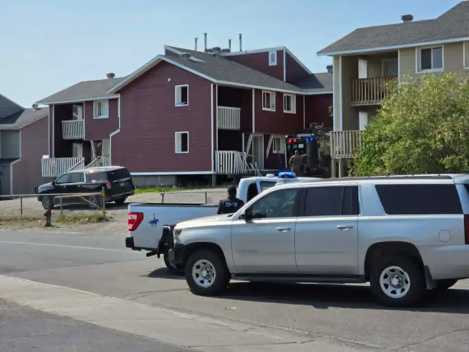 RCMP outside a Williams Avenue building on June 29, 2026. Jesse Wheeler/Cabin Radio