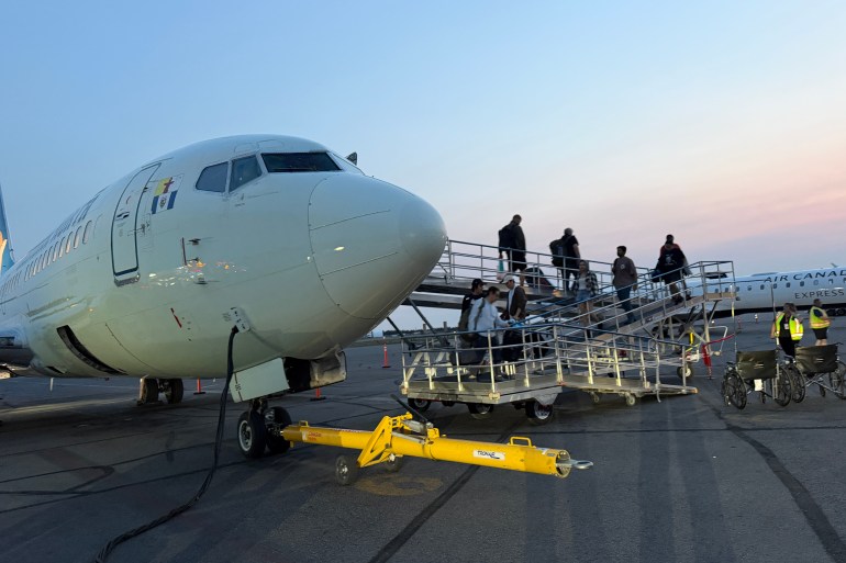 Evacuees from Fort Simpson arrive into Yellowknife on a Canadian North flight at 1:50am on Monday, June 29. Photo: Trung Bui