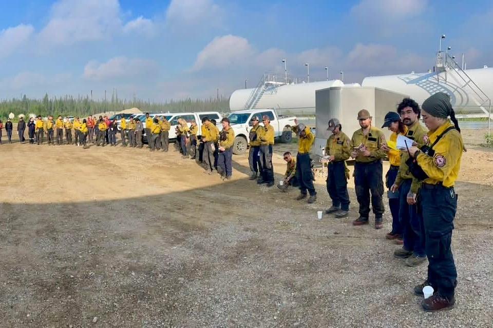 Fire crews at a briefing in Fort Simpson are seen in a photo published by the Łı́ı́dlı̨ı̨ Kų́ę́ First Nation.