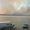 Smoke over Fort Simpson is seen from across the Mackenzie River on the afternoon of July 3, 2026. Photo: Murray Sibbeston