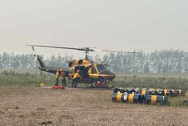 Crews working on a wildfire near Wrigley in July 2026. Photo: NWT Fire