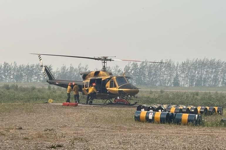 Crews working on a wildfire near Wrigley in July 2026. Photo: NWT Fire