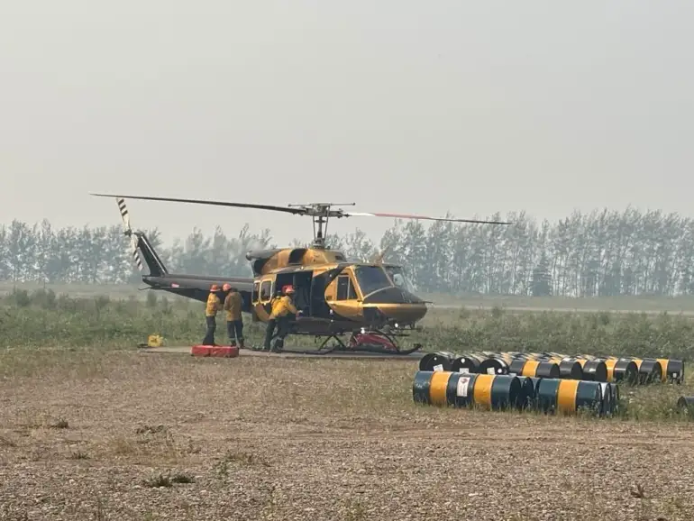 Crews working on a wildfire near Wrigley in July 2026. Photo: NWT Fire