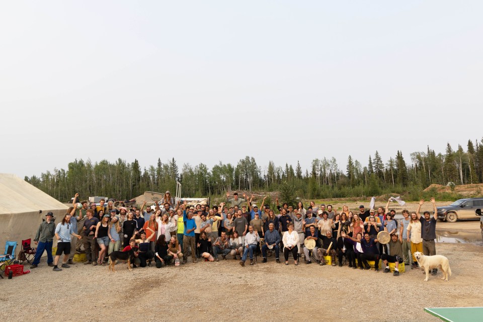 Tree planters and members of the Tthets’éhk’édélı̨ First Nation gather for a group photo on the last day of their planting project outside Jean Marie River. Claire McFarlane/Cabin Radio