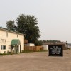 A sign outside the Dehcho First Nations Office in Fort Simpson reads: "To all firefighters, thank you for saving our town." Claire McFarlane/Cabin Radio