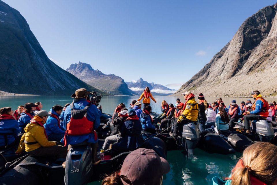 Musician Mia Kelly sings for North-to-North Expedition participants in the Tasermiut Fjord. Photo: Students on Ice