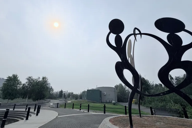Smoky air over Yellowknife's Somba K'e Park on July 6, 2026. Dieselle Ford/Cabin Radio