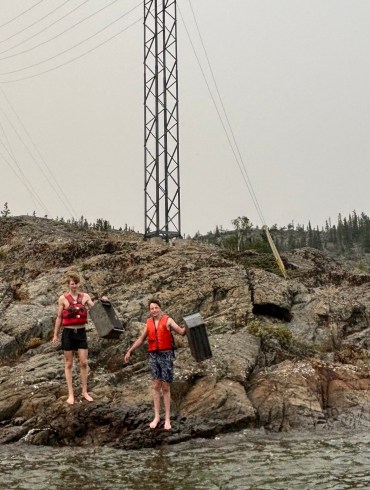 Ignat Tarskii and Nick Girvan were among Yellowknifers who rapidly responded to a brush fire on July 1, 2026. Photo submitted by Scott Robertson