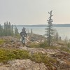 Rudy Vital, a YKDFN Dechįta Nàowo instructor, works to put out a brush fire on July 2, 2026. Photo: Submitted