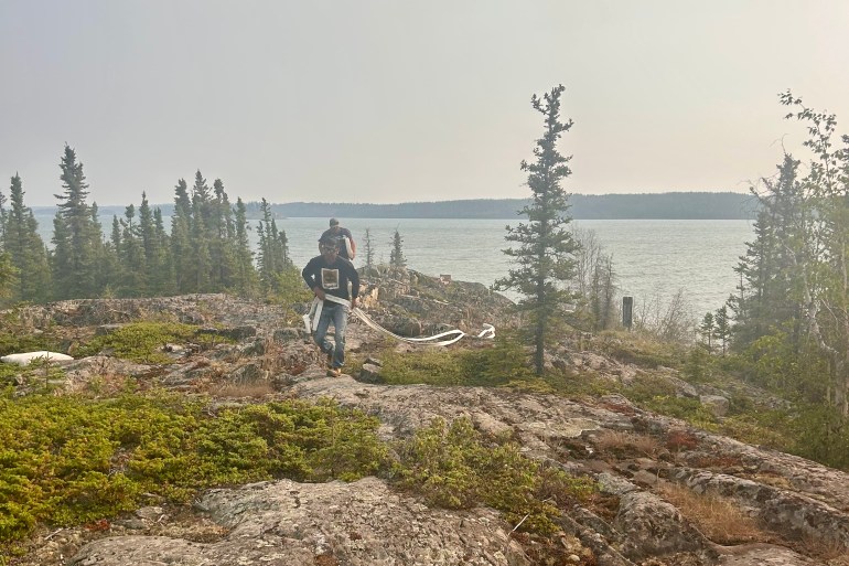 Jayden Liske, a Ndılǫ resident, helps to tackle fire ZF027 on July 2, 2026. Photo: Submitted