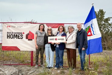 Dignitaries at a housing announcement in Yellowknife on July 27, 2026. Aastha Sethi/Cabin Radio