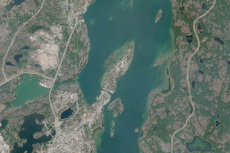 The Ndılǫ peninsula, centre, above the city of Yellowknife, is seen in a Sentinel-2 satellite image from June 30, 2026.