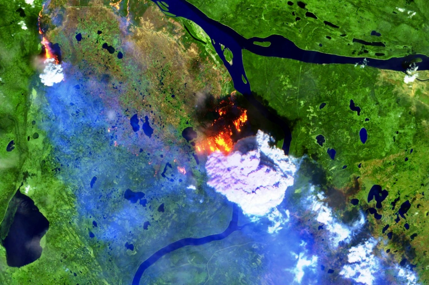 A false-colour Sentinel-2 satellite image shows heat signatures and the smoke plume of fire FS016 as it is blown south of Fort Simpson on Saturday, July 4.