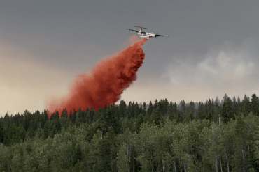 An air tanker working above the snye just west of Fort Simpson's island on July 4, 2026. Photo: NWT Fire