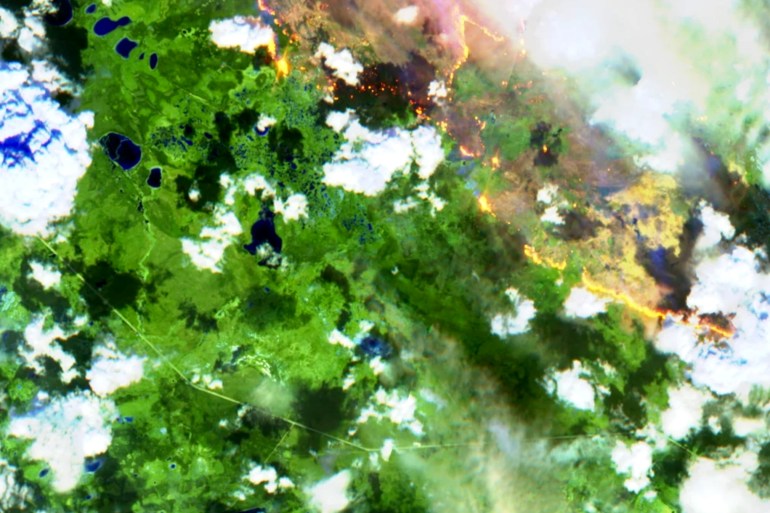 Wildfires in Wood Buffalo National Park burn near Highway 5 (bottom left) in a false-colour Sentinel-2 satellite image from July 2, 2026.